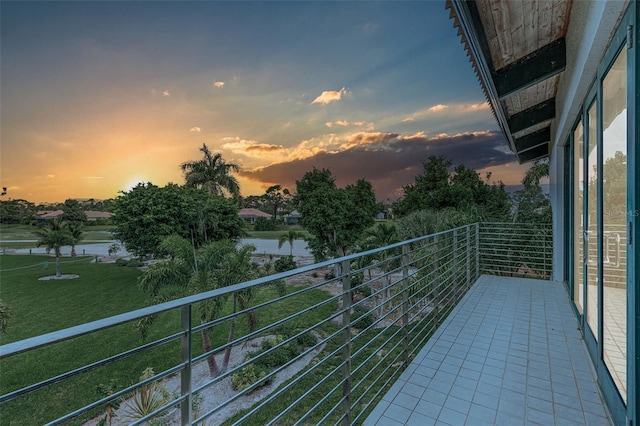 balcony at dusk with a water view