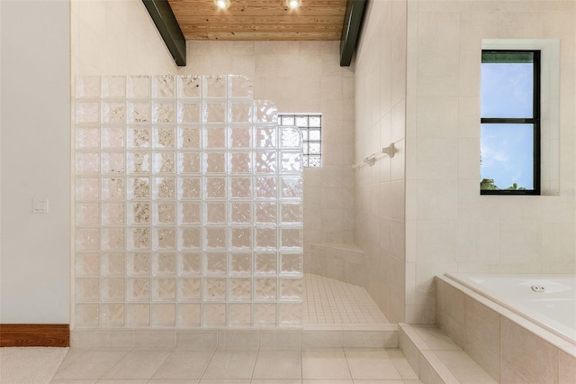 full bath with tile walls, a walk in shower, wooden ceiling, beamed ceiling, and tile patterned floors