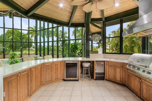 unfurnished sunroom featuring wooden ceiling, ceiling fan, wine cooler, and a wealth of natural light