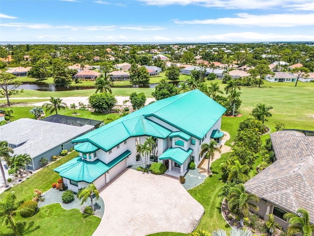 bird's eye view with a residential view and a water view