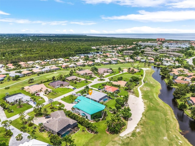 drone / aerial view featuring a water view and a residential view