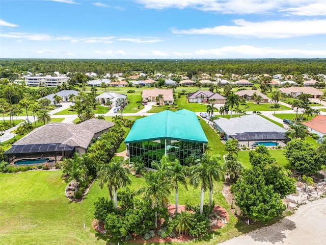 birds eye view of property with a residential view