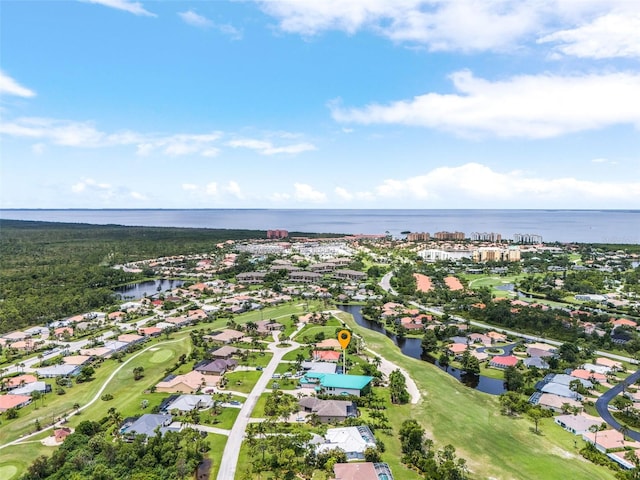 bird's eye view with a water view and a residential view