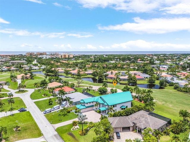 bird's eye view featuring a residential view and a water view