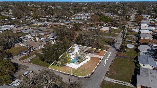 birds eye view of property with a residential view