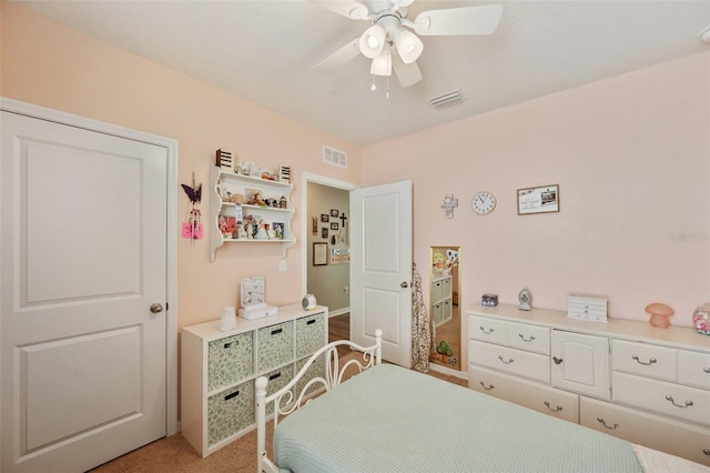 bedroom featuring visible vents and ceiling fan