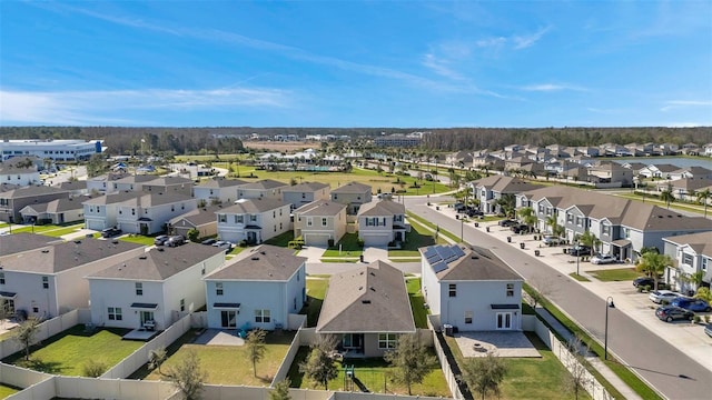 birds eye view of property with a residential view