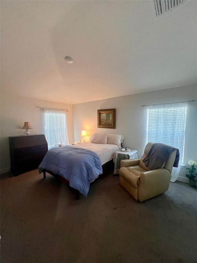 bedroom featuring carpet floors and visible vents