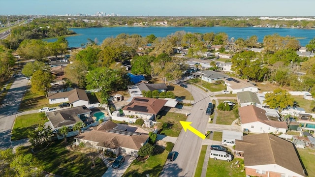 drone / aerial view with a water view and a residential view