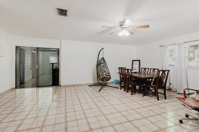 dining space featuring baseboards, visible vents, and a ceiling fan