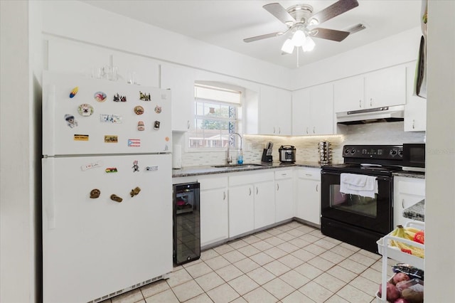 kitchen featuring visible vents, a sink, beverage cooler, under cabinet range hood, and black appliances