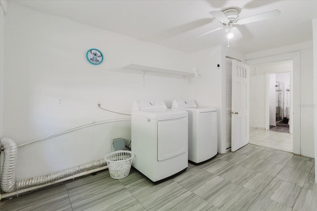 washroom featuring laundry area, separate washer and dryer, and a ceiling fan