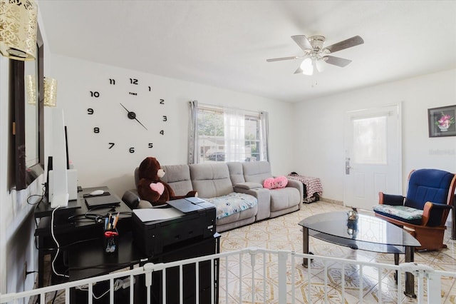 living area with a ceiling fan