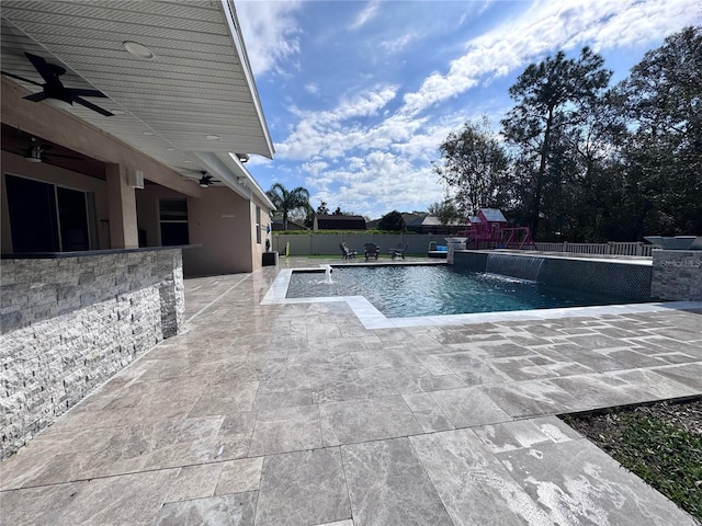 view of pool featuring a fenced in pool, a playground, a ceiling fan, a patio area, and fence