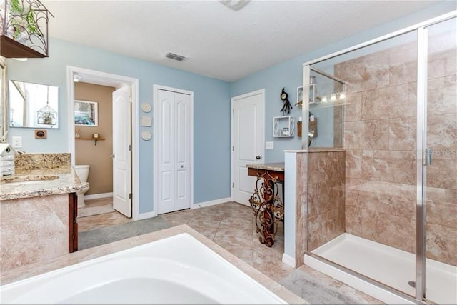 full bathroom with visible vents, toilet, a shower stall, vanity, and baseboards