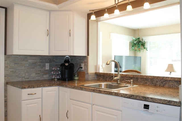 kitchen featuring a sink, dark countertops, white cabinetry, and dishwasher