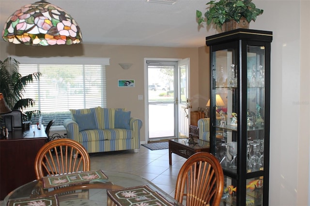 dining area with light tile patterned floors