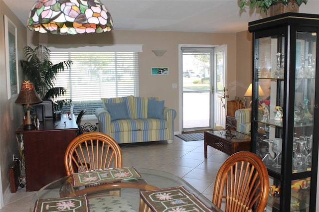 dining area with light tile patterned floors