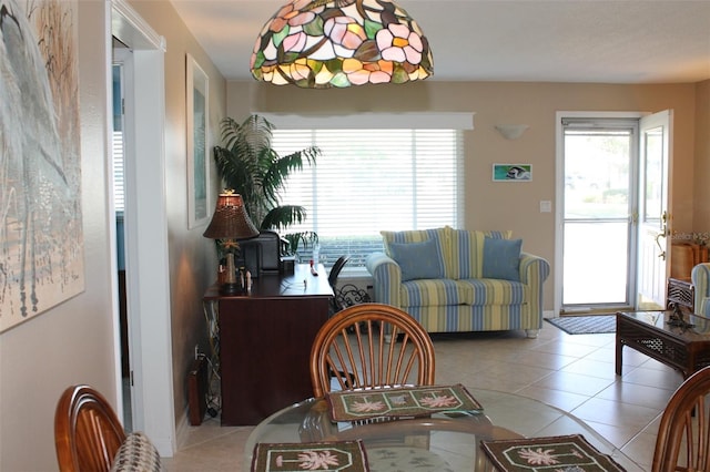 dining area featuring light tile patterned floors