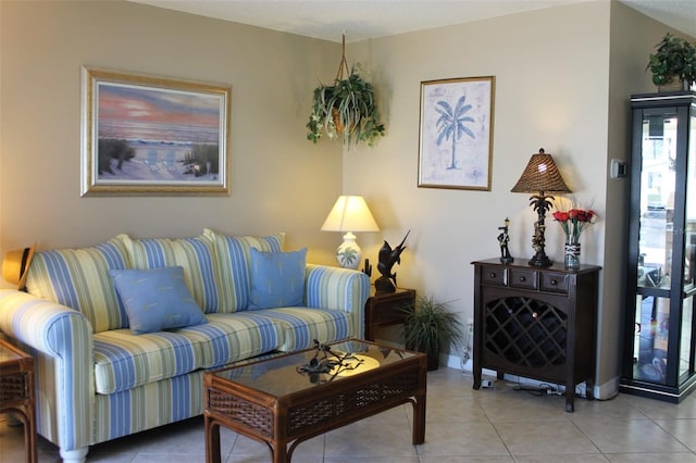 living room with tile patterned flooring and baseboards