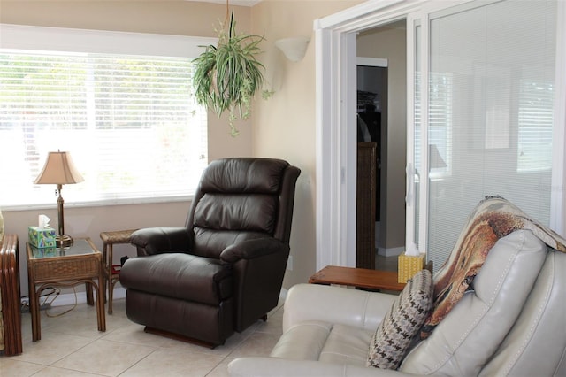 living area with light tile patterned floors