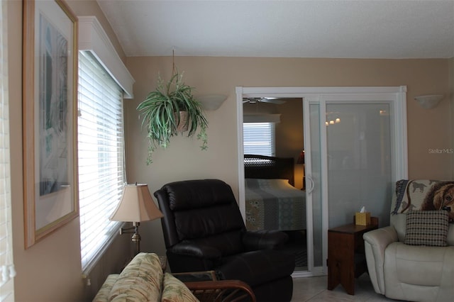 sitting room with light tile patterned flooring and plenty of natural light