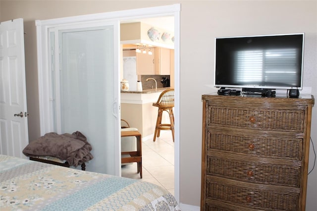 bedroom featuring light tile patterned flooring