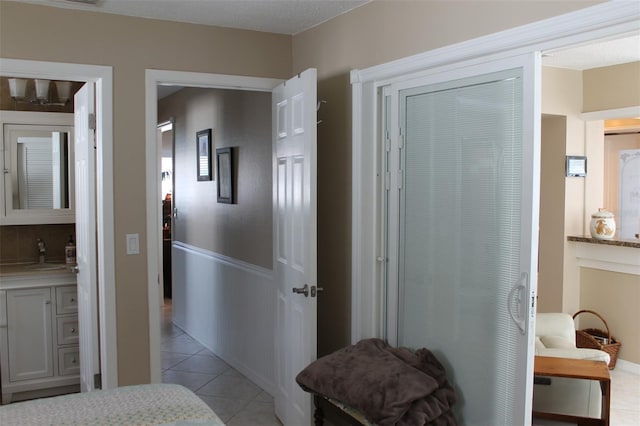 interior space featuring a sink and light tile patterned flooring