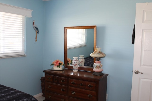 bedroom featuring multiple windows