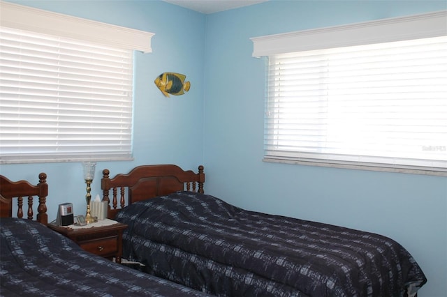 bedroom featuring multiple windows