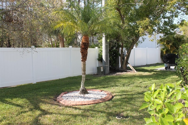 view of yard with a fenced backyard