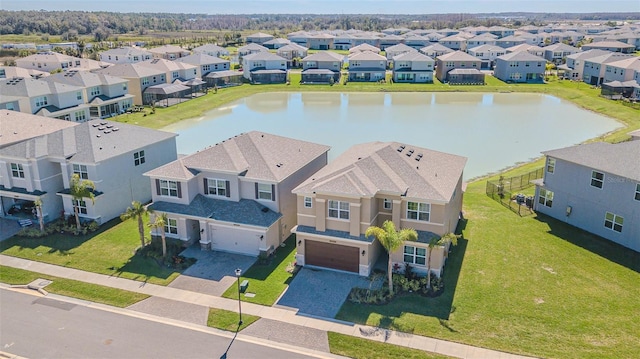 bird's eye view with a water view and a residential view