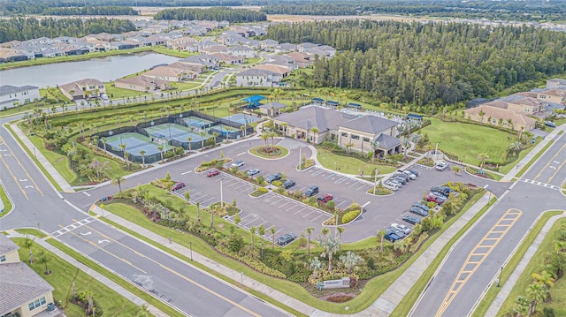 drone / aerial view featuring a water view and a residential view