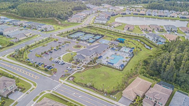 aerial view with a water view and a residential view