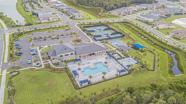 birds eye view of property with a residential view