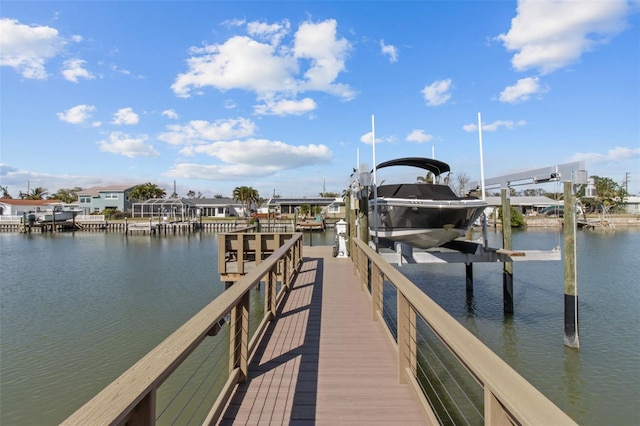 dock area featuring a water view and boat lift