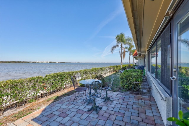 view of patio featuring a water view