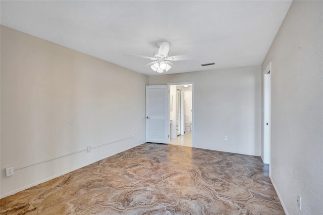 spare room featuring visible vents and a ceiling fan