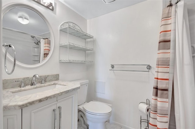 full bathroom featuring toilet, marble finish floor, and vanity