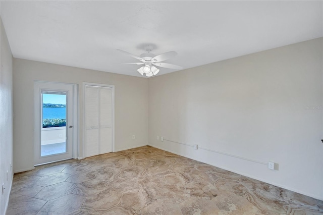 unfurnished room featuring a ceiling fan