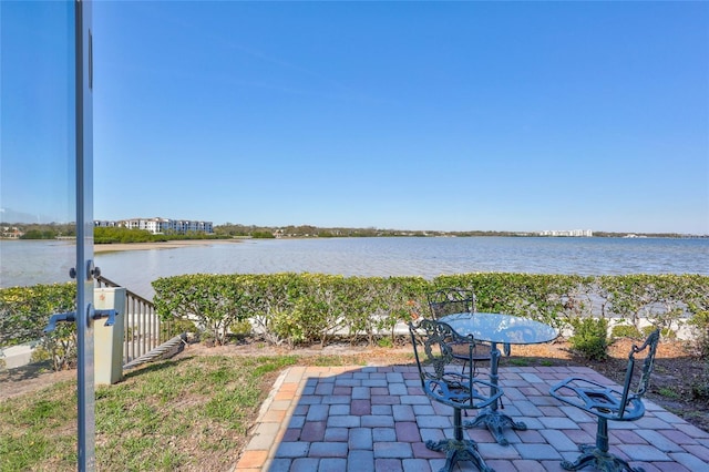 view of patio / terrace with a water view