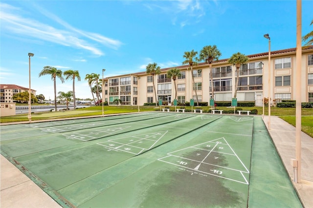 view of home's community with shuffleboard