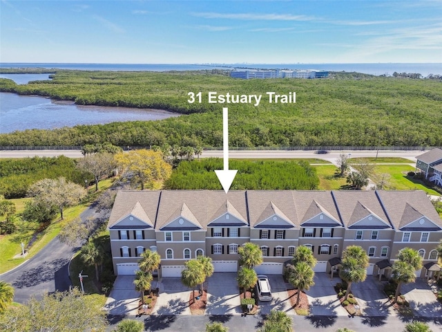 birds eye view of property with a water view