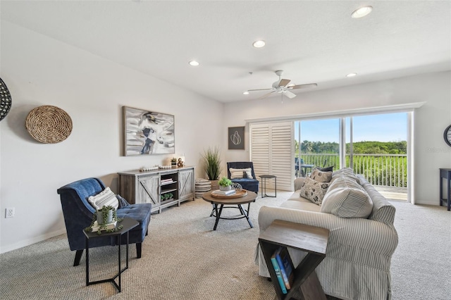 living room featuring recessed lighting, baseboards, ceiling fan, and light colored carpet