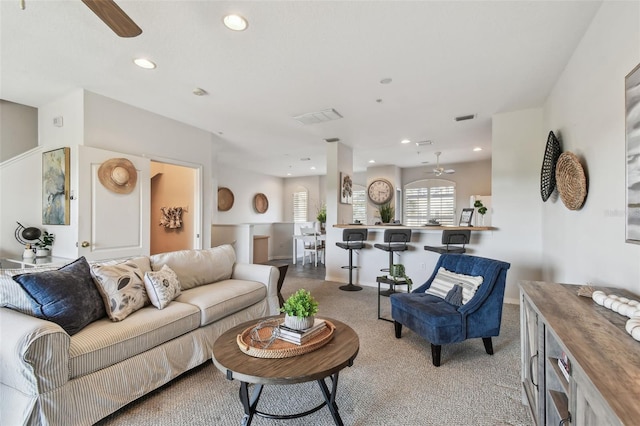living room with recessed lighting, visible vents, ceiling fan, and light colored carpet