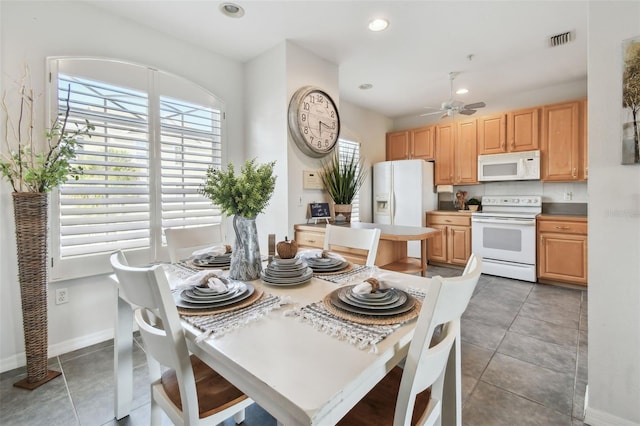 tiled dining area with baseboards, a ceiling fan, visible vents, and recessed lighting