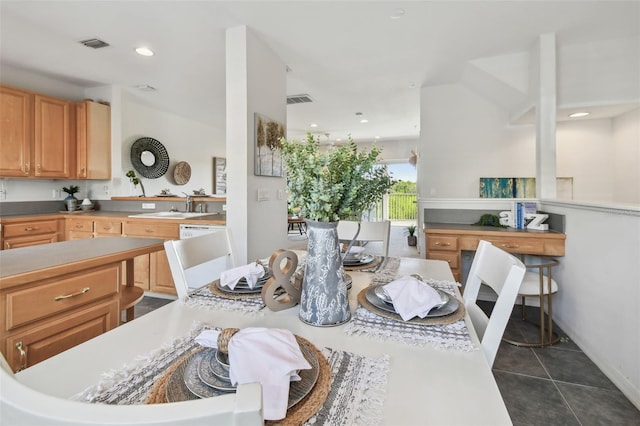 dining space featuring dark tile patterned flooring, visible vents, and recessed lighting