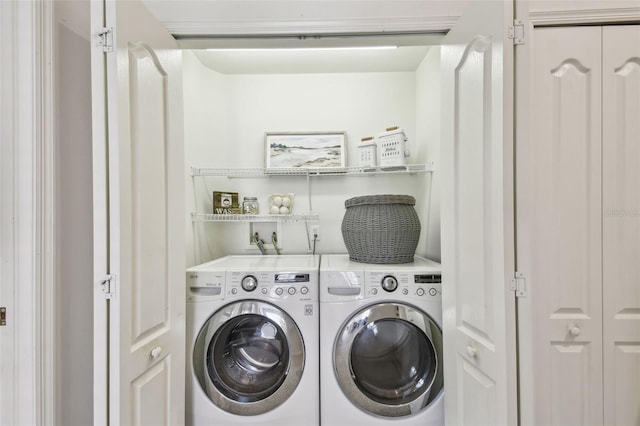 washroom with laundry area and independent washer and dryer