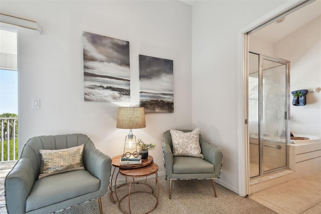 living area featuring tile patterned flooring
