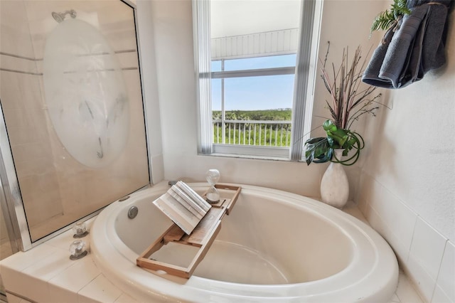bathroom with a garden tub